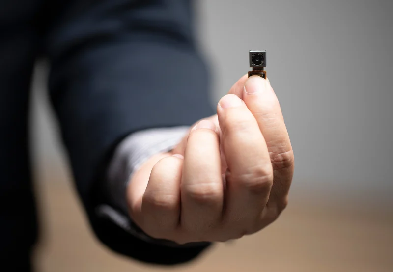 A device is a pinhole camera used for discreet security monitoring.
