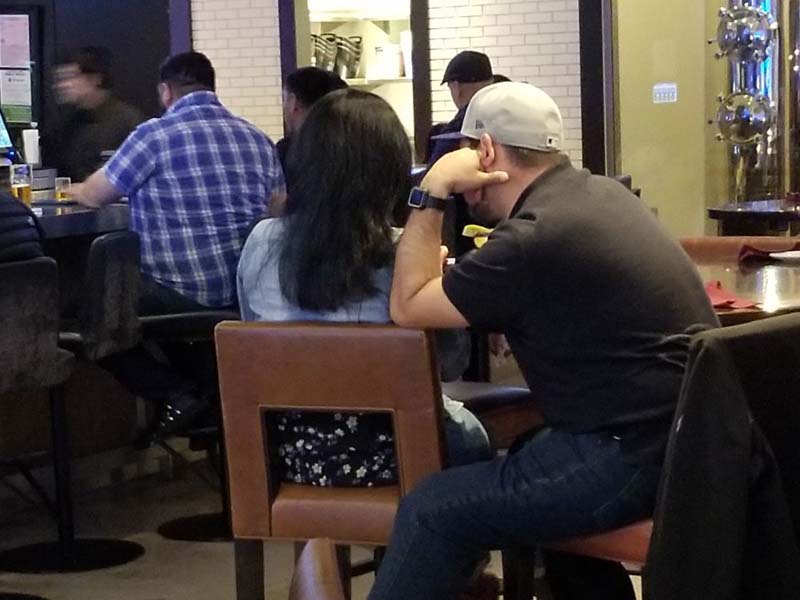 Licensed private investigator conducting a discreet cheating spouse investigation.