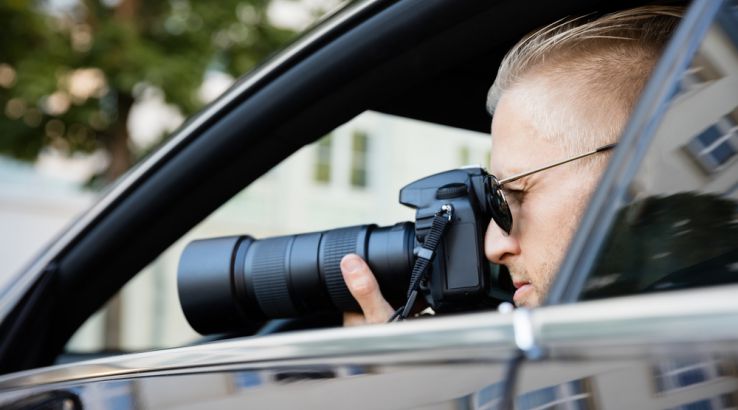 Licensed private investigator conducting an undercover investigation to gather confidential evidence.